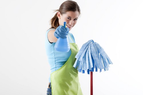 Cleaner in protective equipment carrying out a safe cleaning task