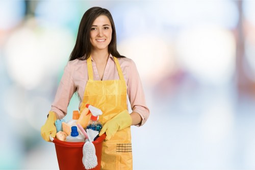Cleaner wearing PPE while working with professional equipment